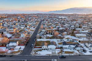 Aerial view at dusk featuring a mountain view