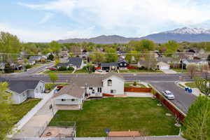 Drone / aerial view with a residential view and a mountain view