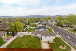 Drone / aerial view featuring a mountain view and a residential view