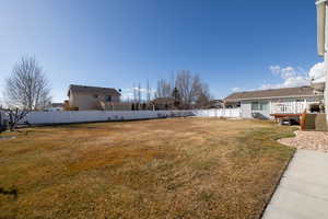 View of yard featuring a wooden deck