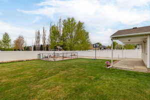View of yard featuring a patio area and a fenced backyard