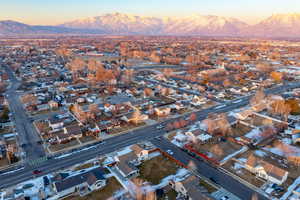 Aerial view at dusk featuring a mountain view