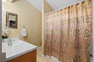 Bathroom with tile patterned flooring and vanity