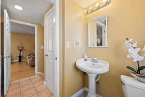 Bathroom with tile patterned floors and toilet