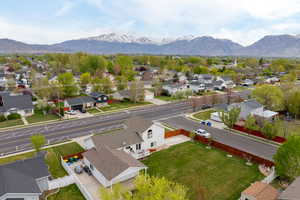Birds eye view of property featuring a mountain view and a residential view