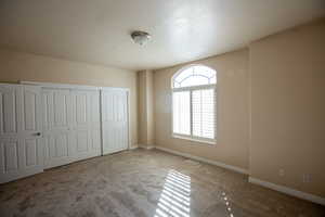 Bedroom #1 featuring light carpet and a huge closet