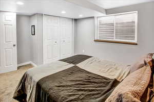 Bedroom with carpet floors and a closet