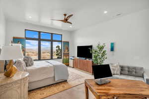 Bedroom featuring ceiling fan and light hardwood / wood-style floors