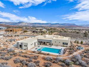 Birds eye view of property featuring a mountain view