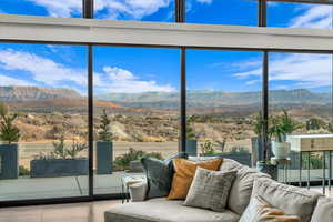 Unfurnished sunroom featuring a mountain view