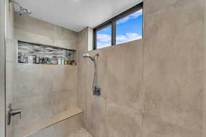 Bathroom featuring tiled shower