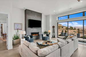 Tiled living room featuring a tiled fireplace