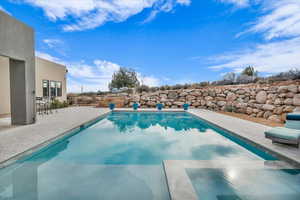 View of swimming pool featuring a patio area