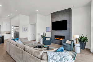 Living room featuring a tile fireplace