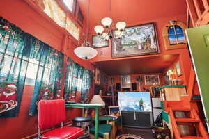 Garage Area: Interior space featuring a chandelier