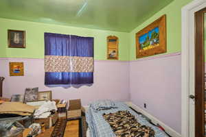 Bedroom featuring hardwood / wood-style flooring