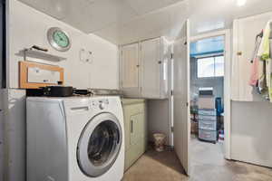 Laundry area with cabinets and washer and dryer