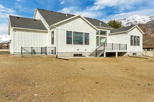 Back of property featuring a mountain view