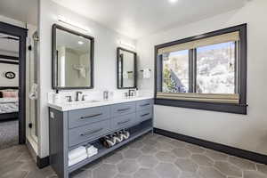 Bathroom with tile patterned flooring and vanity