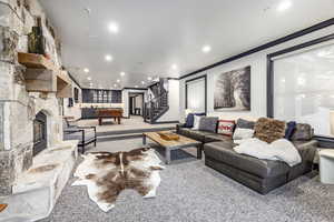 Carpeted living room featuring a fireplace