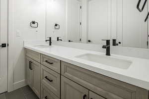 Bathroom with vanity and tile patterned floors