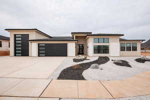 Prairie-style house with a garage