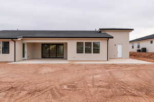 Rear view of property with a patio and central air condition unit