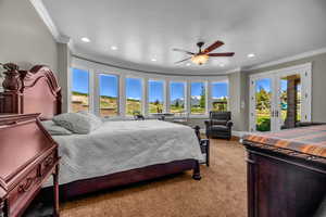 Bedroom featuring access to outside, light colored carpet, ceiling fan, crown molding, and french doors