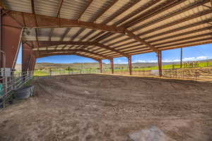 View of horse barn featuring a mountain view and a rural view