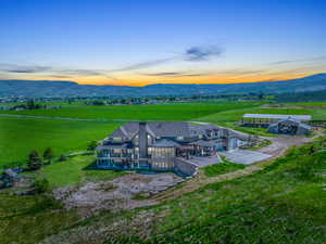 Aerial view at dusk with a rural view and a mountain view