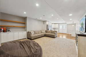 Living room with light hardwood / wood-style flooring