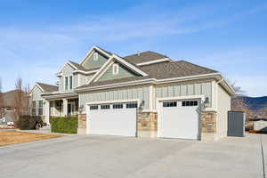 View of front facade with a garage and covered porch