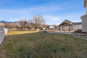 View of yard featuring a gazebo, a mountain view, and a patio