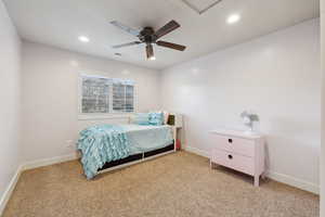 Bedroom featuring light colored carpet and ceiling fan