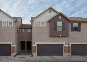 View of front of property with a garage