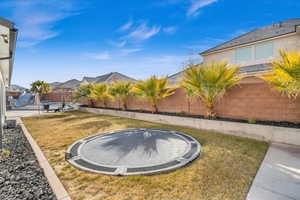 View of yard with a trampoline