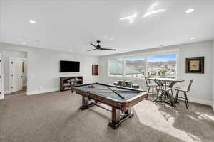 Rec room with ceiling fan, light colored carpet, and pool table