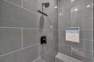 Bathroom featuring a tile shower