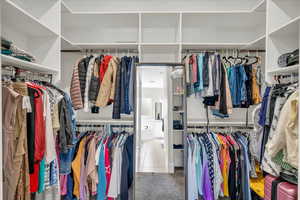 Spacious closet featuring tile patterned flooring