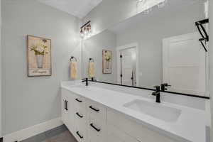 Bathroom with vanity and tile patterned flooring