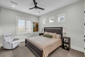 Bedroom featuring ceiling fan and light colored carpet