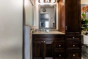 Bathroom with vanity and toilet