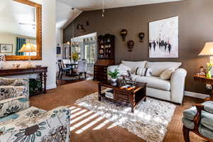 Living room featuring lofted ceiling