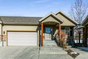 View of front facade featuring a garage