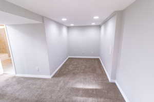 Basement with carpet flooring