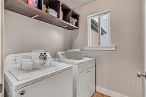 Laundry area featuring separate washer and dryer