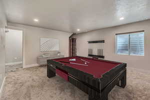 Game room featuring billiards and carpet