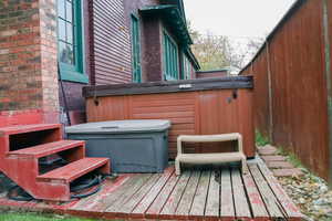 Wooden deck with a hot tub