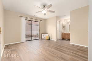 Unfurnished room with light hardwood / wood-style floors and ceiling fan