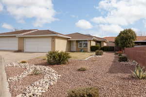 Single story home featuring a garage